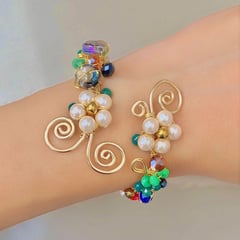 GENERICO - PULSERA BRAZALETE TEJIDA FLORES CON PIEDRA